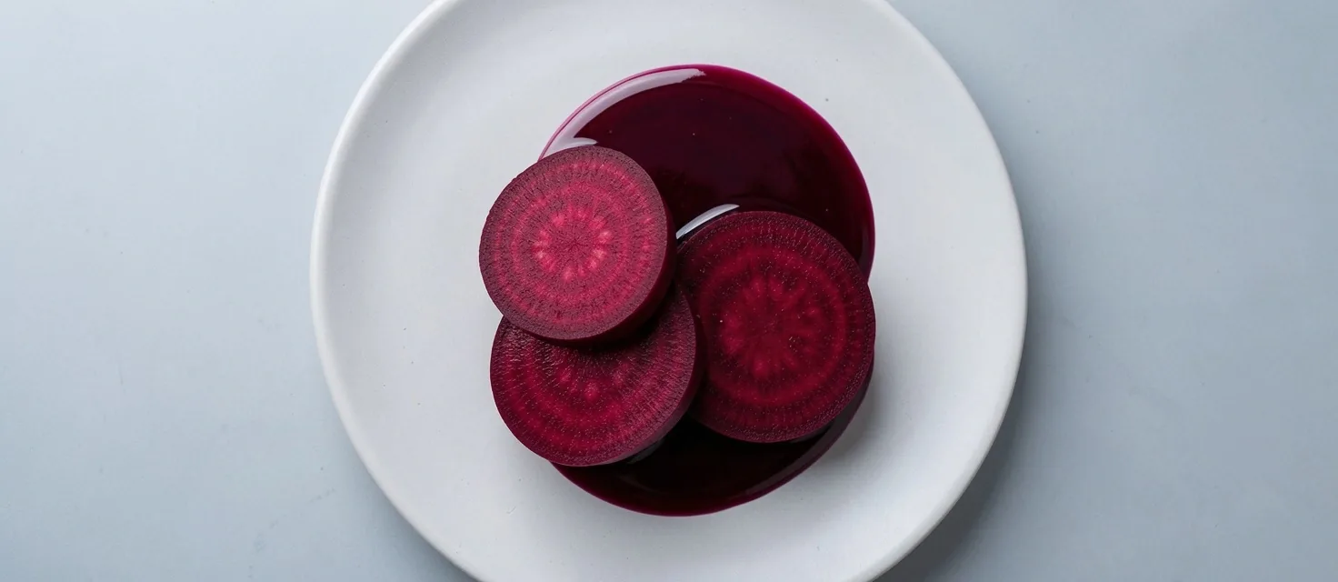 Beetroot cross-sections on a ceramic surface